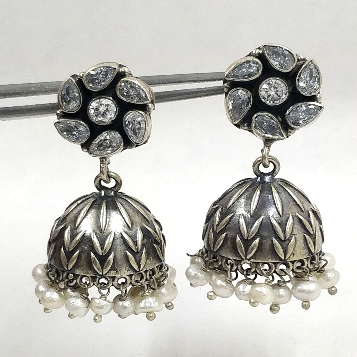Stunning Silver Jhumka Earrings. Crafted from 925 sterling silver, these oxidized earrings add timeless allure.